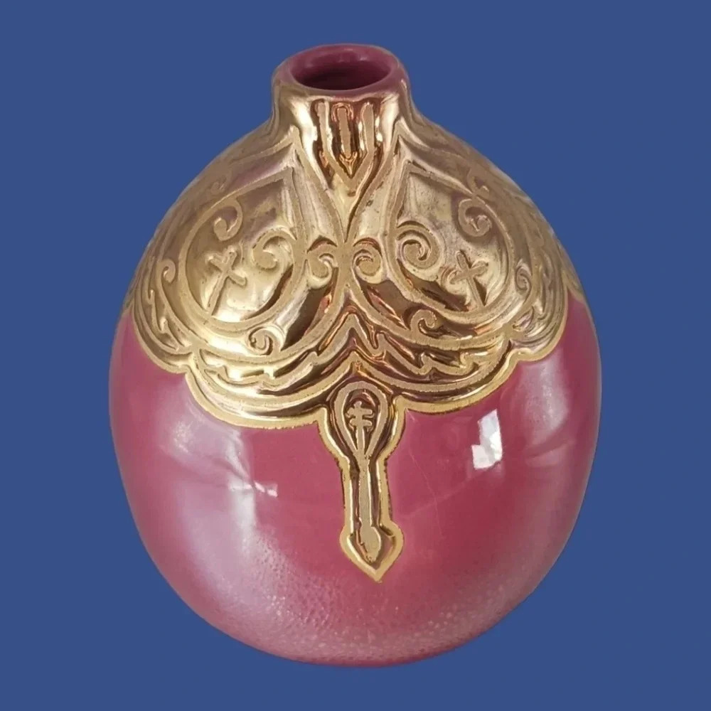 Vintage ceramic engraved vase topped with enameled gold glazed
